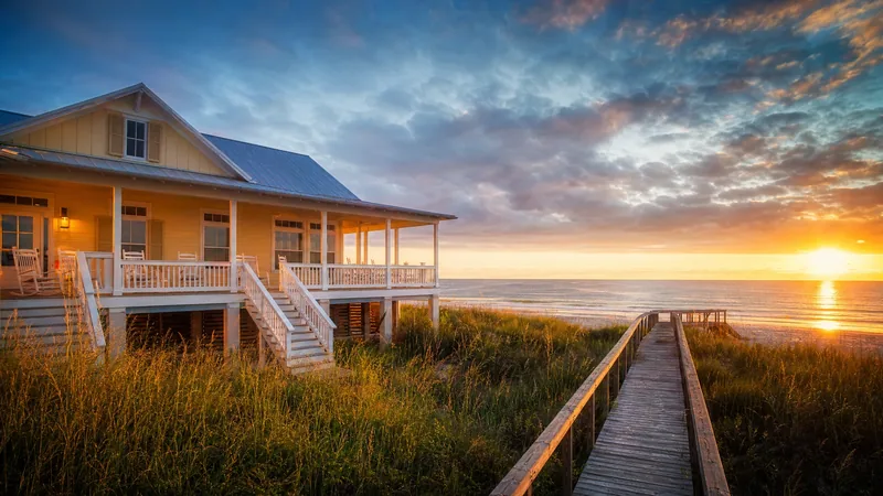Raised beach cottage with a wraparound porch and a dune walkover at sunset, How to Start an Airbnb on Hilton Head Island